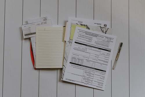 file binder stack of papers flat lay photography accounting